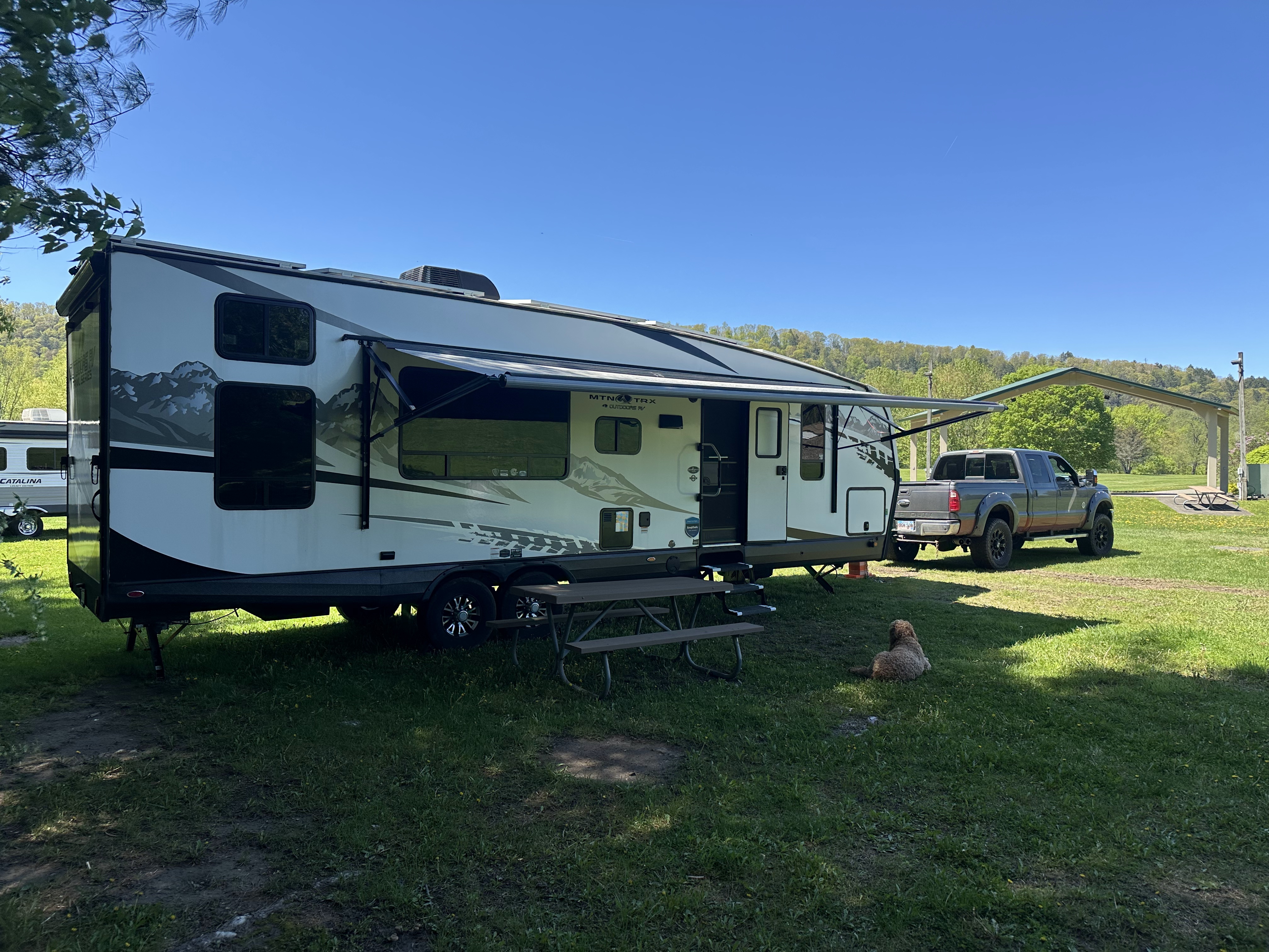 2016 Ford F-350 towing 2022 Outdoors RV Mountain Trail 29TRX toy hauler travel trailer